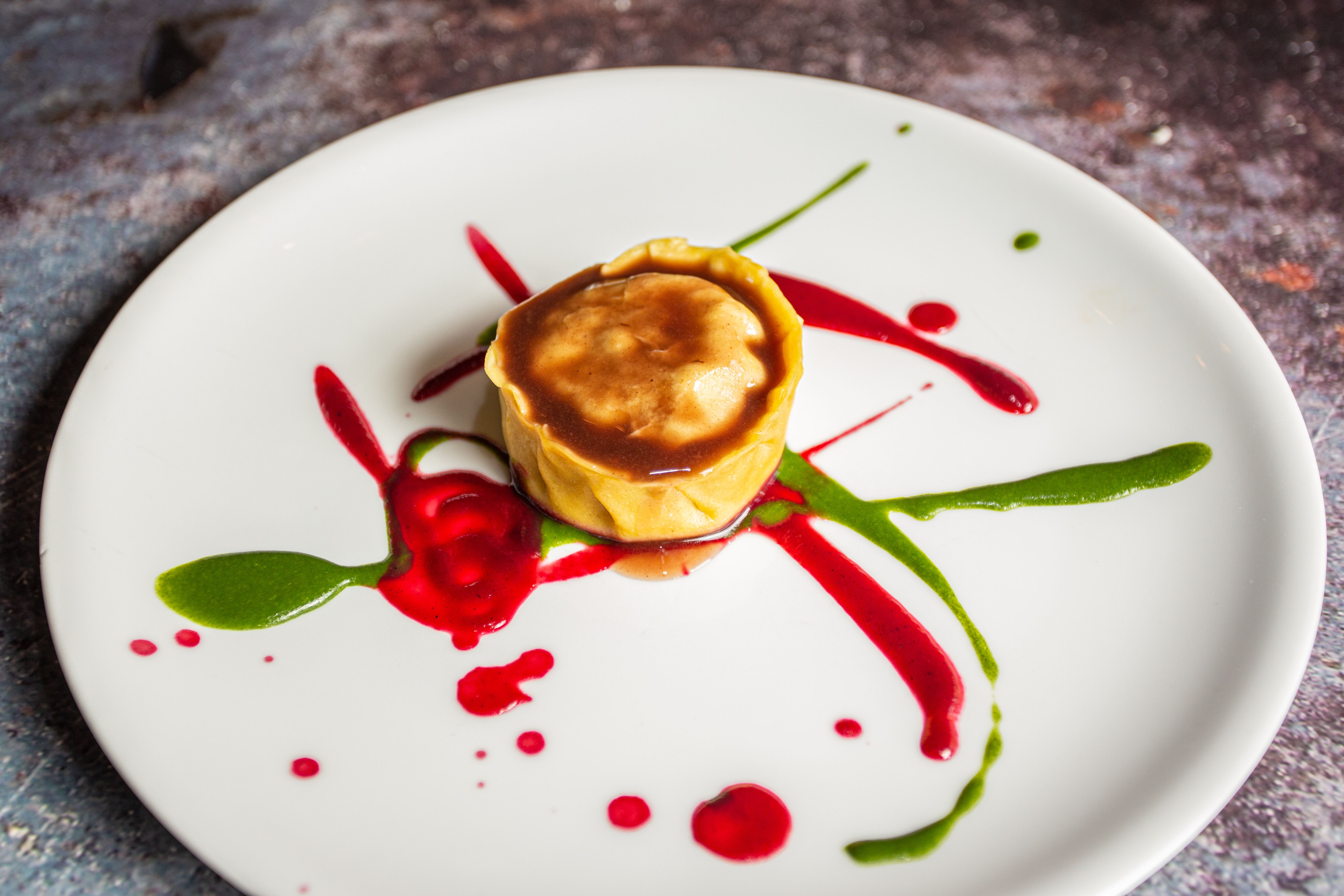 a plate of food with sauce on it