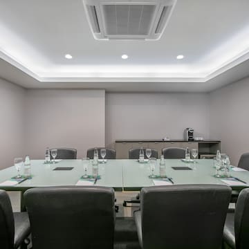 a conference room with a table and chairs