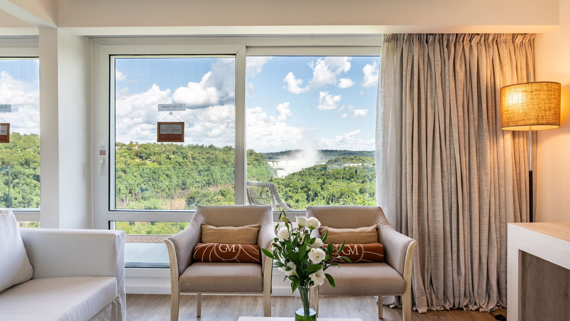 a room with a view of the mountains and trees