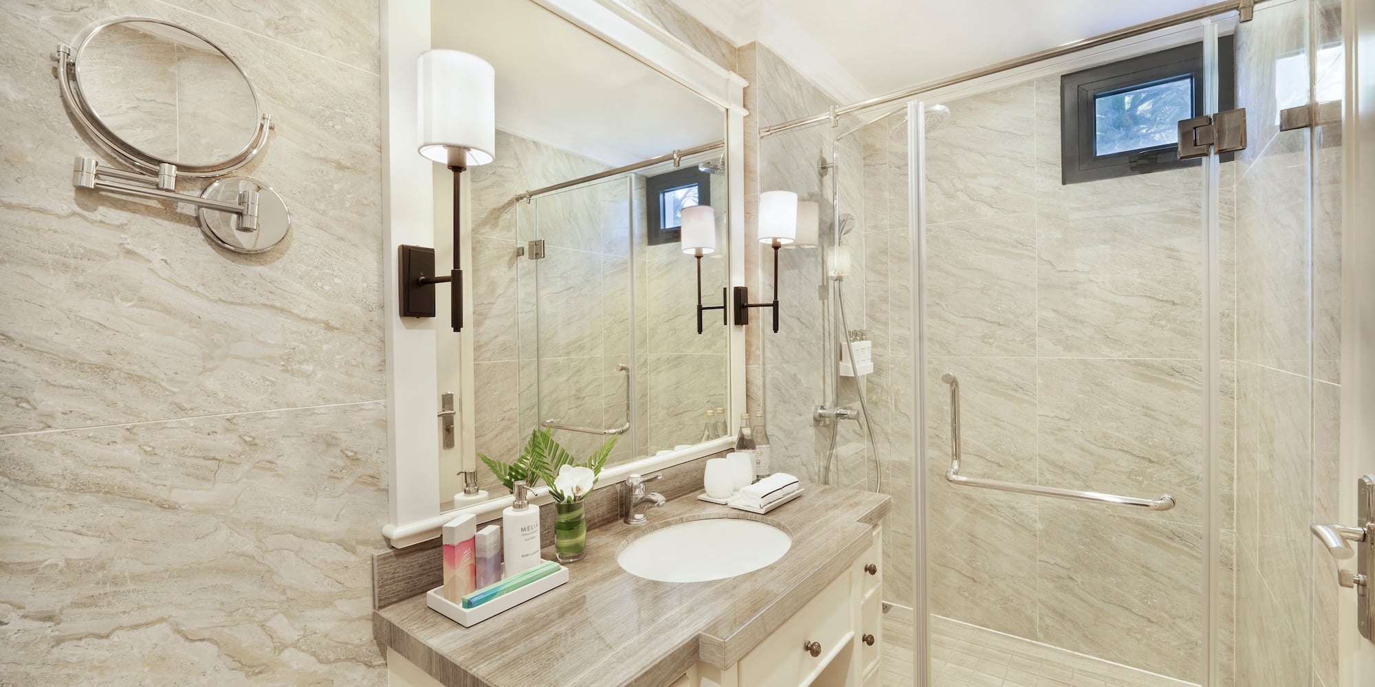 a bathroom with a shower and sink