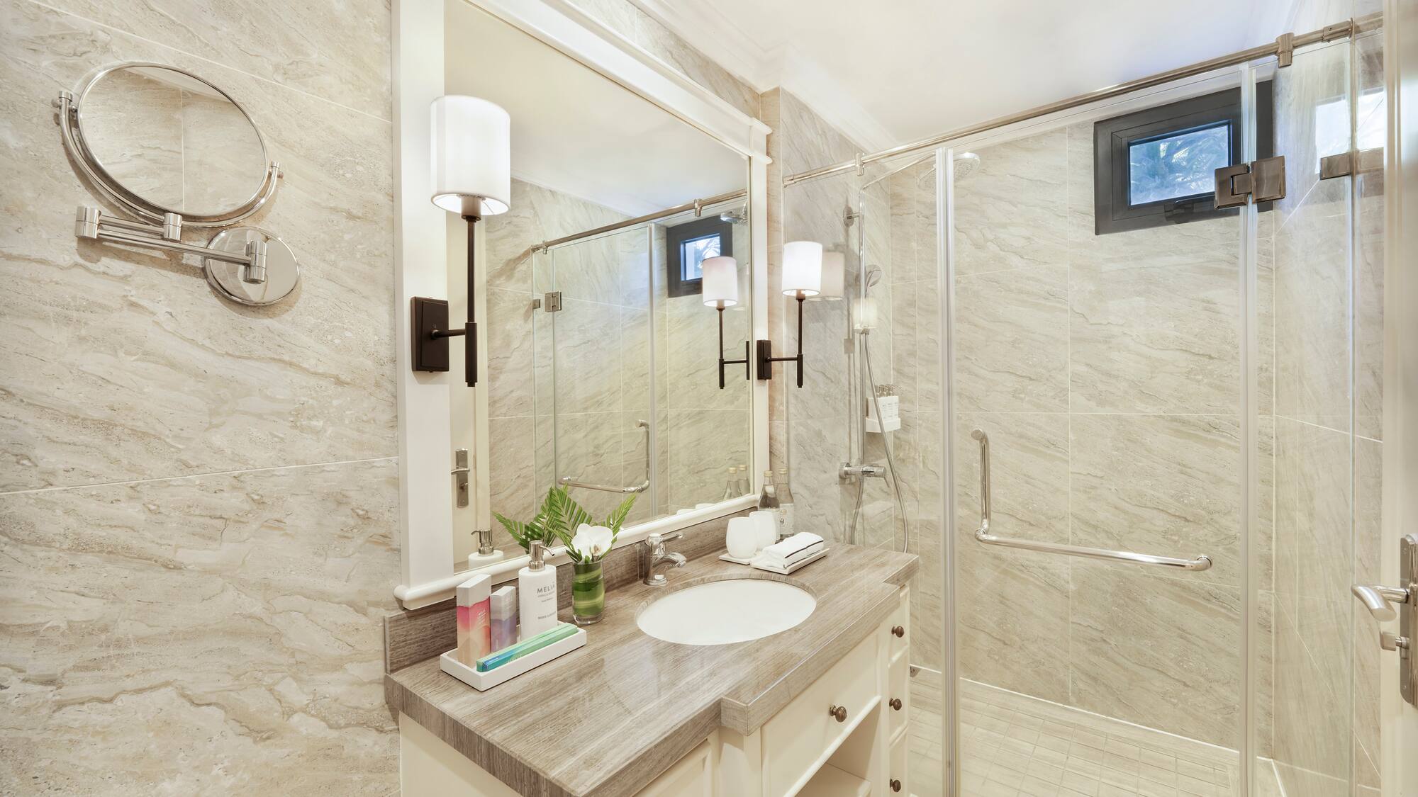 a bathroom with a shower and sink