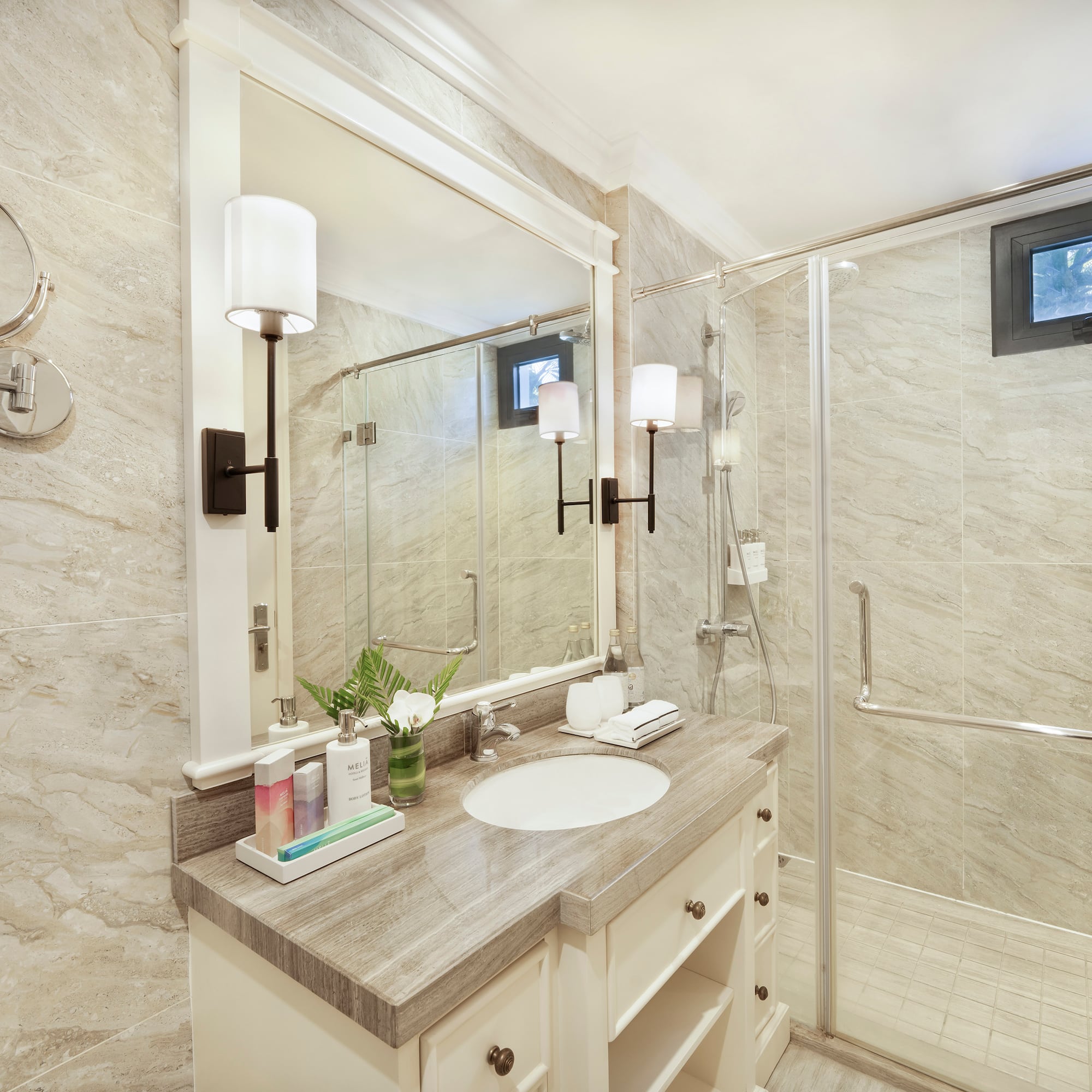 a bathroom with a shower and sink