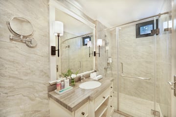 a bathroom with a shower and sink