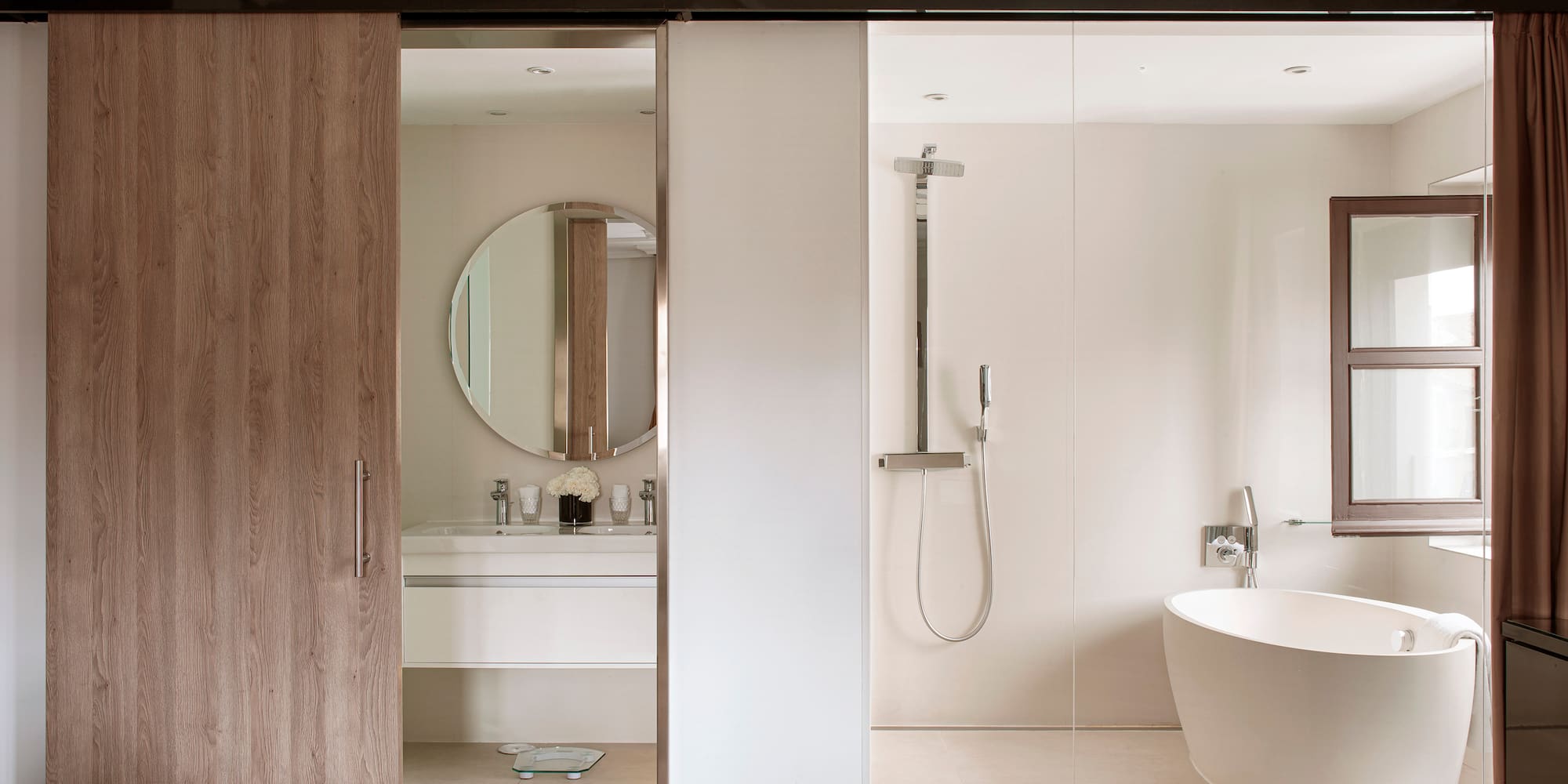 a bathroom with a tub and shower