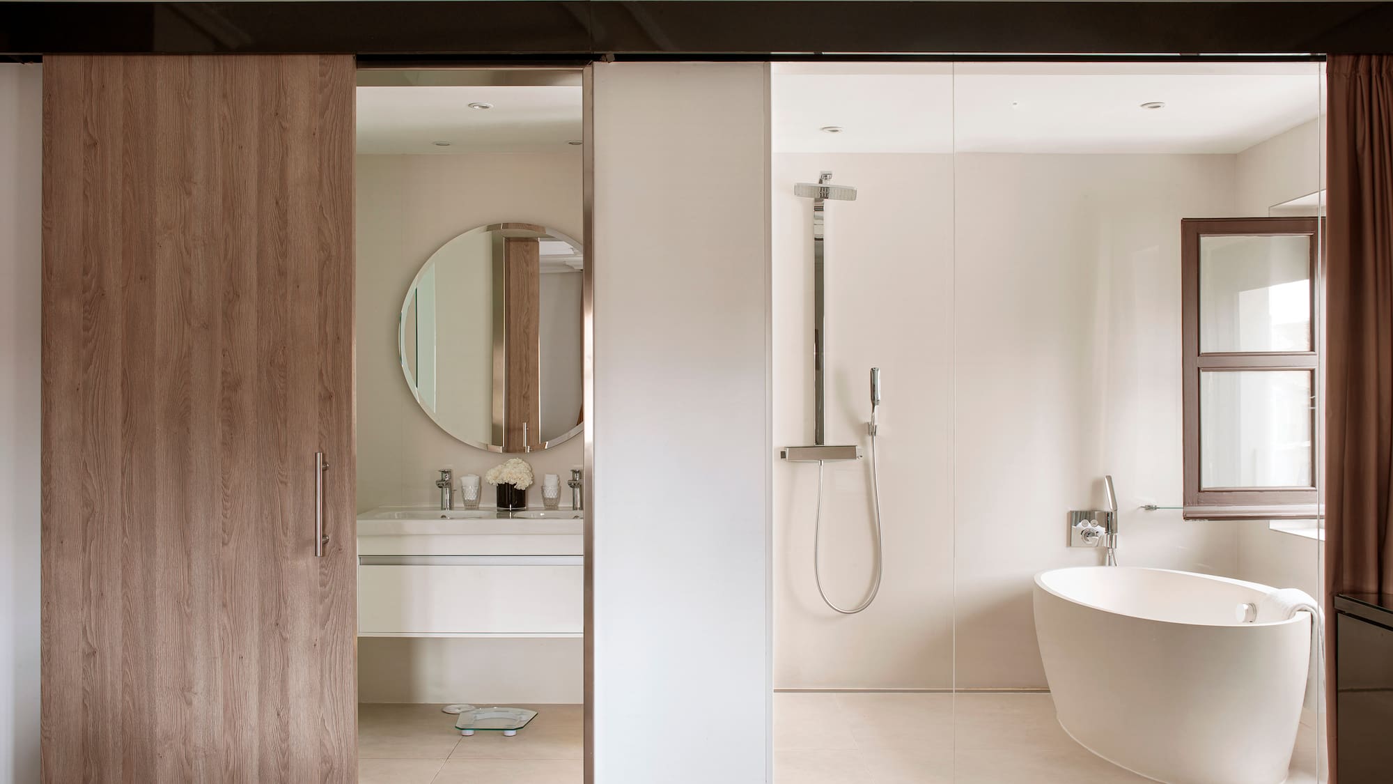a bathroom with a tub and shower