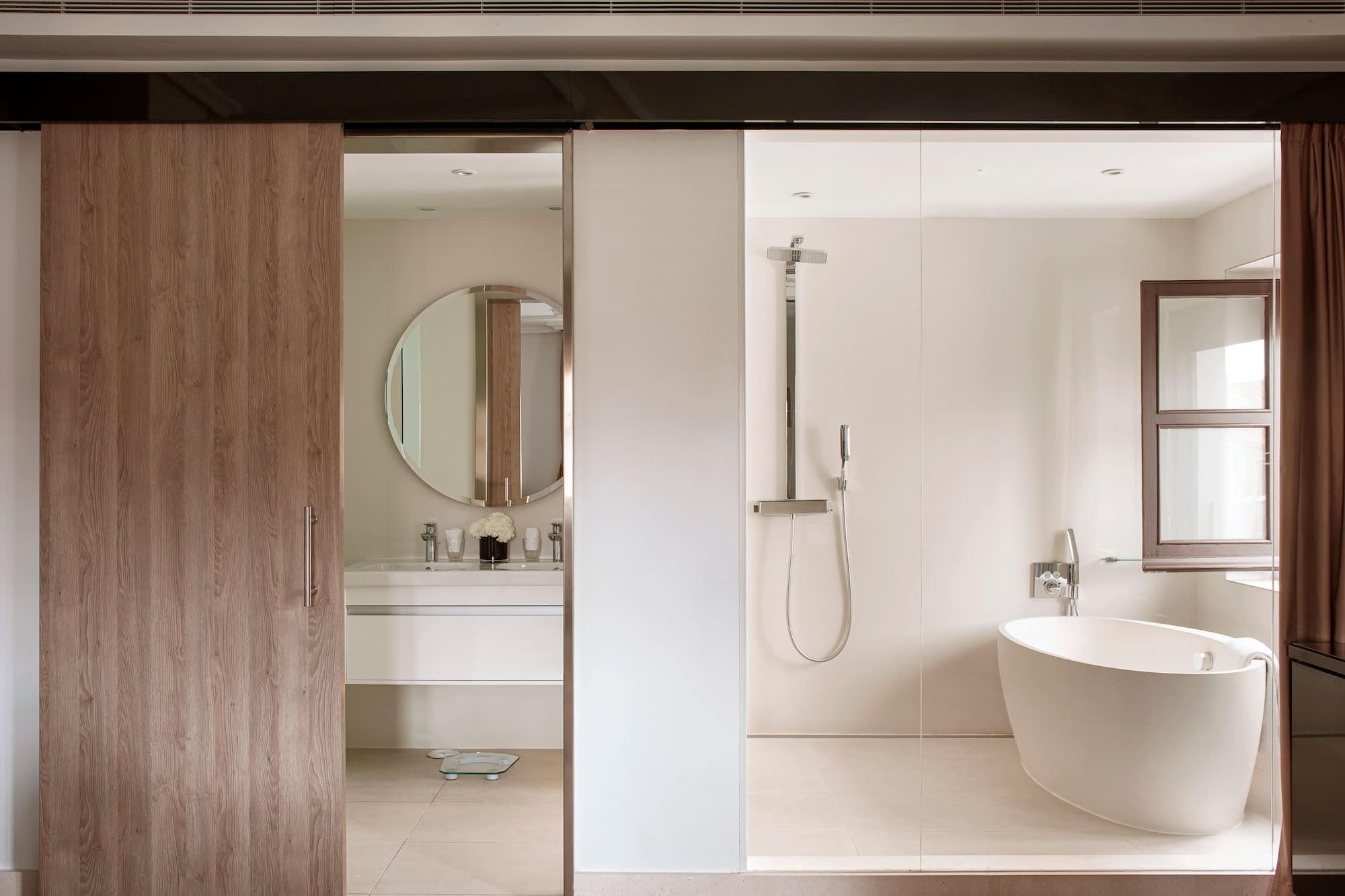 a bathroom with a tub and shower