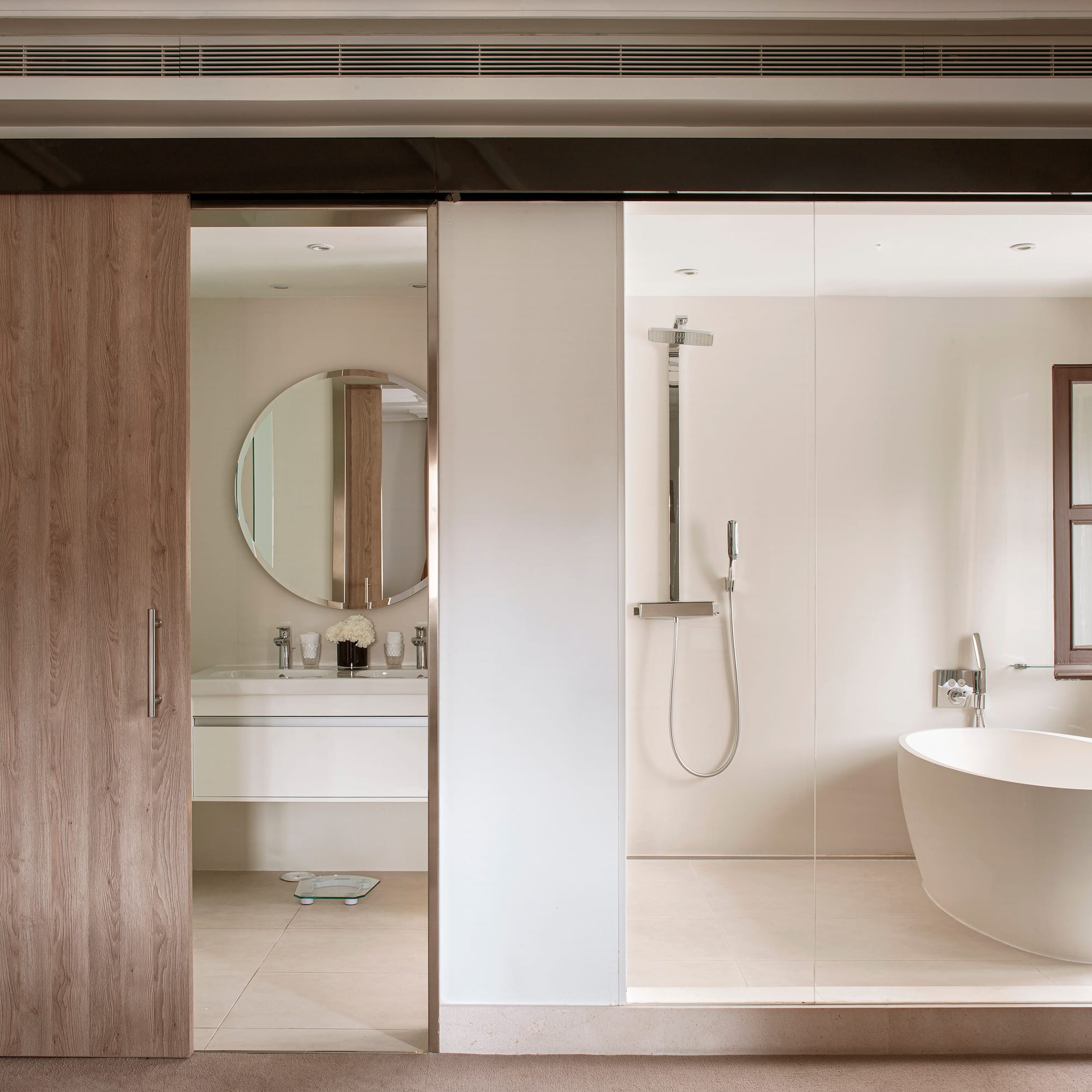 a bathroom with a tub and shower