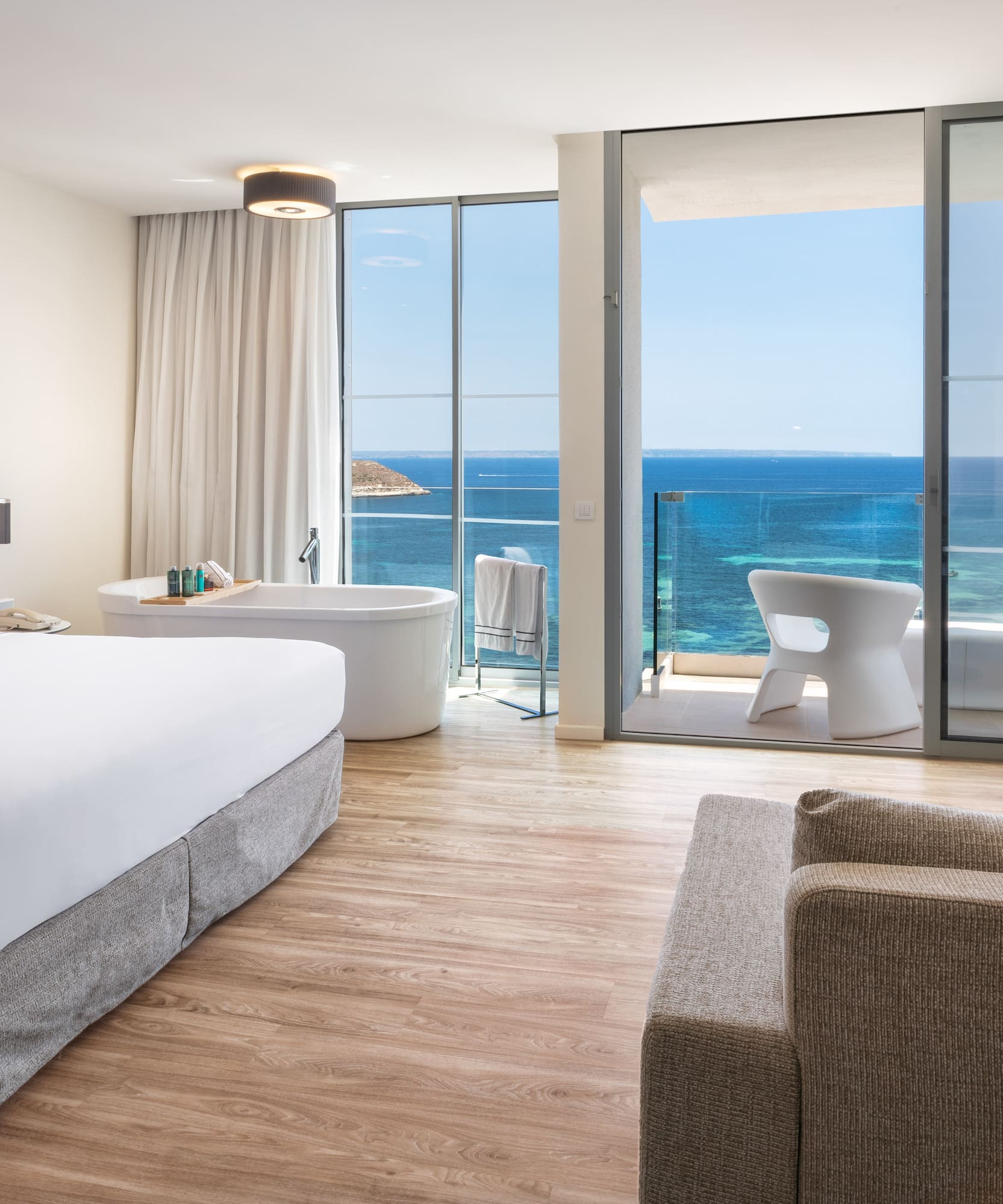 a room with a large window overlooking the ocean