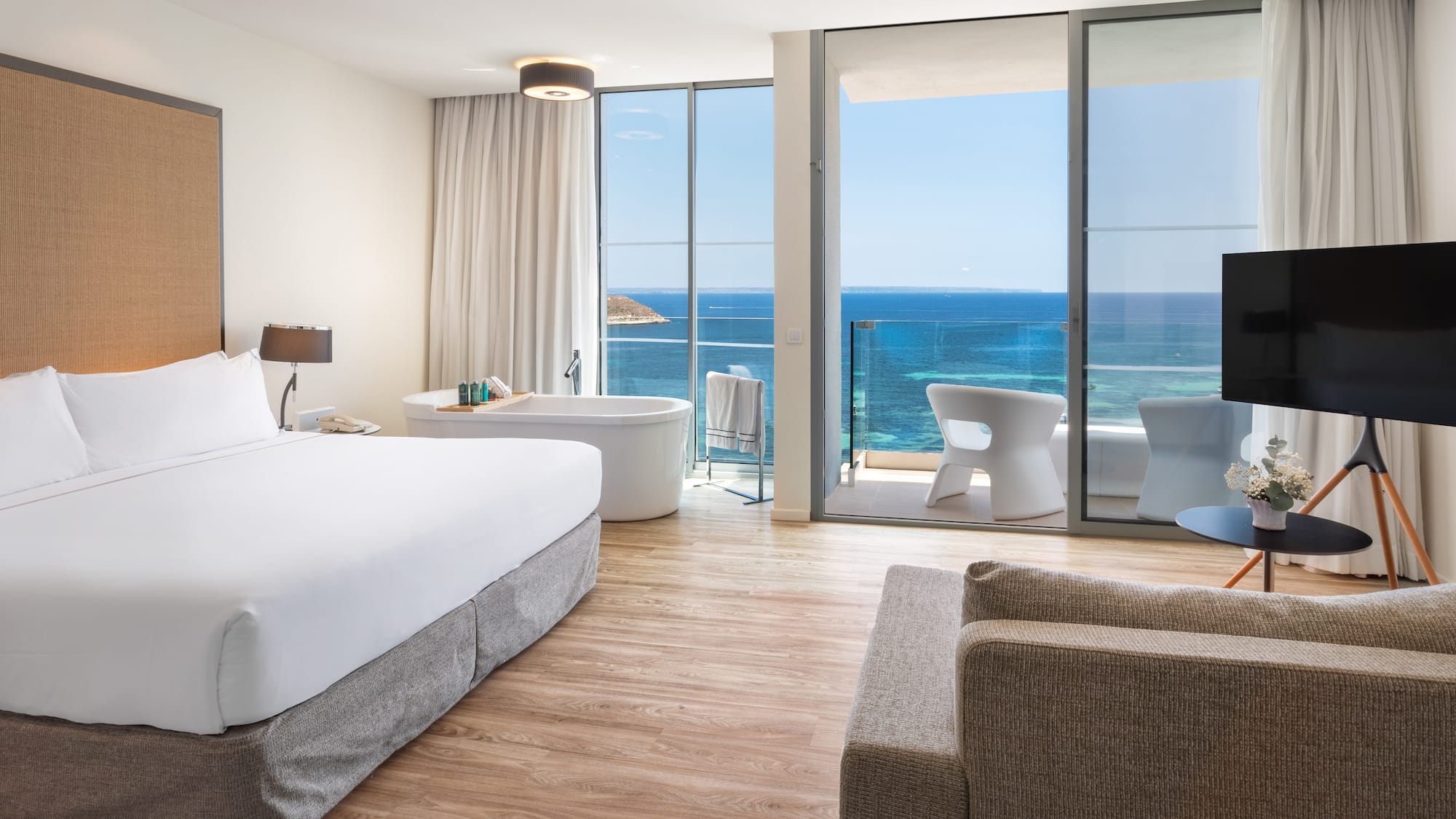 a room with a large window overlooking the ocean