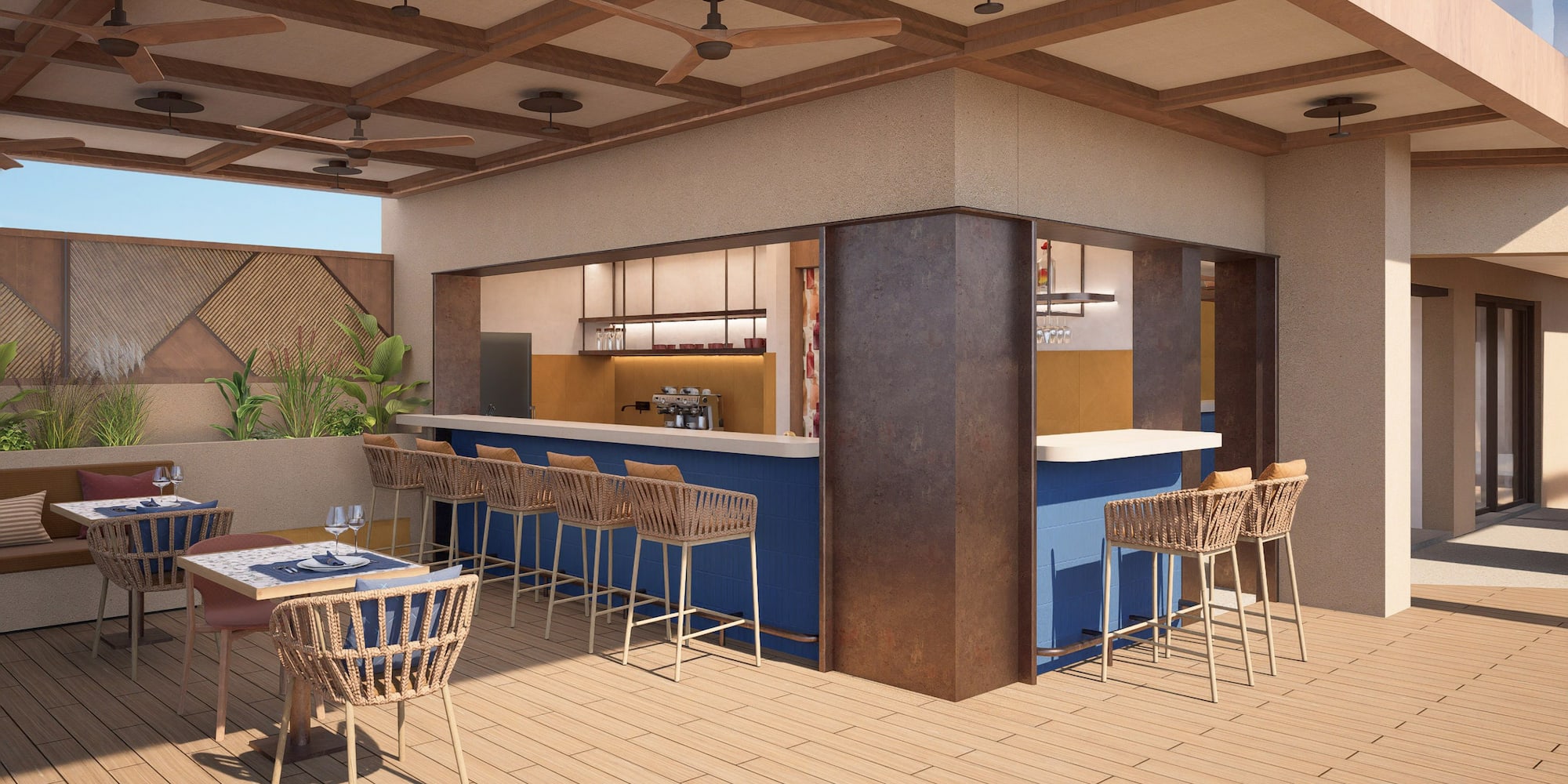 a patio with a bar and chairs