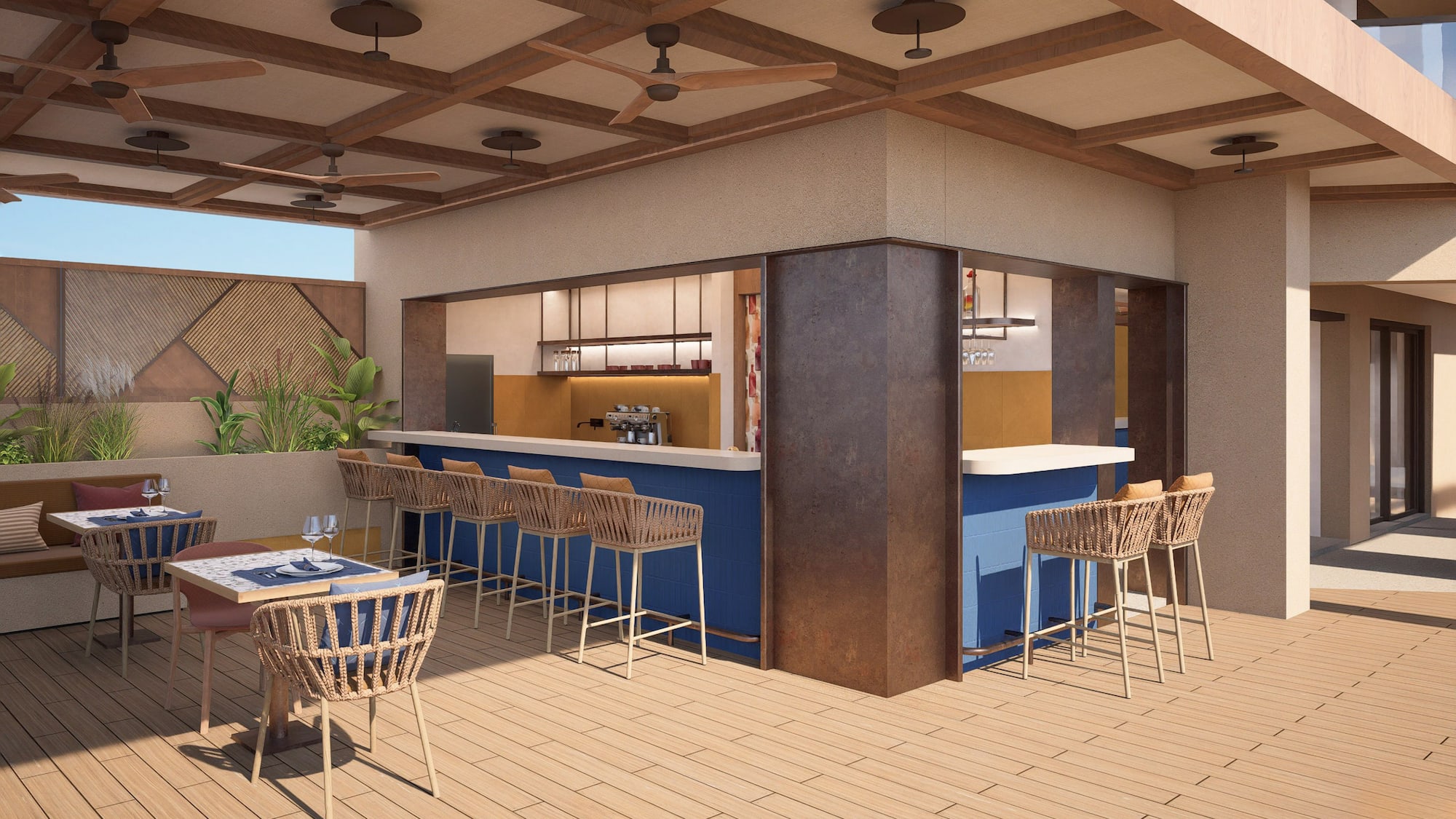 a patio with a bar and chairs