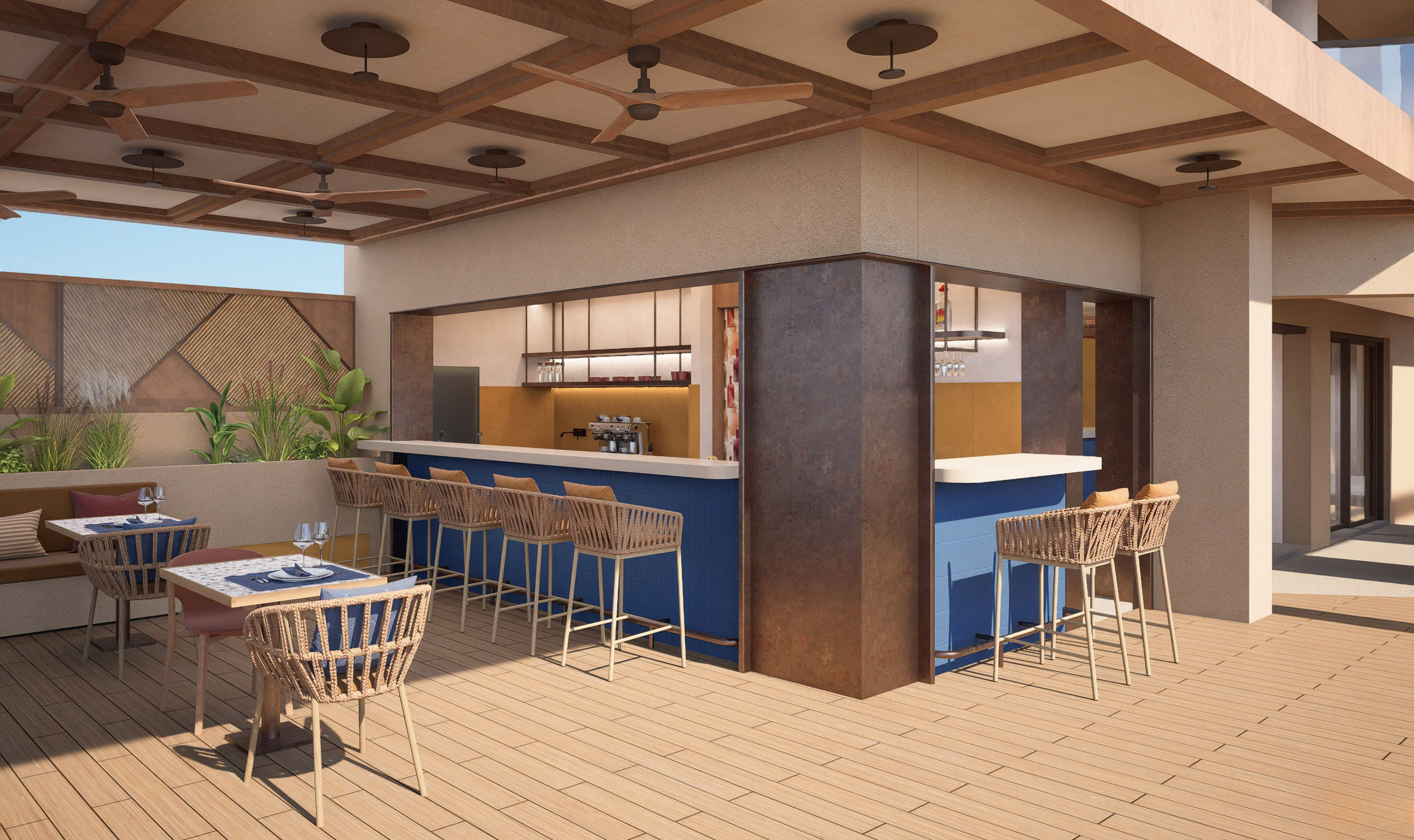 a patio with a bar and chairs