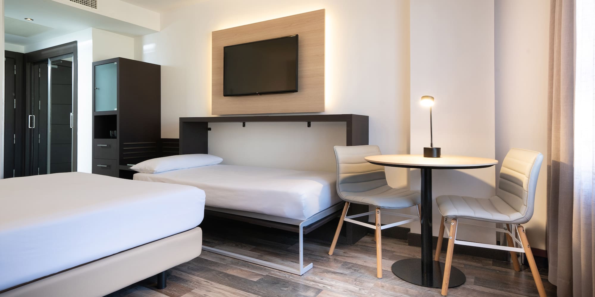 a room with a tv and a table