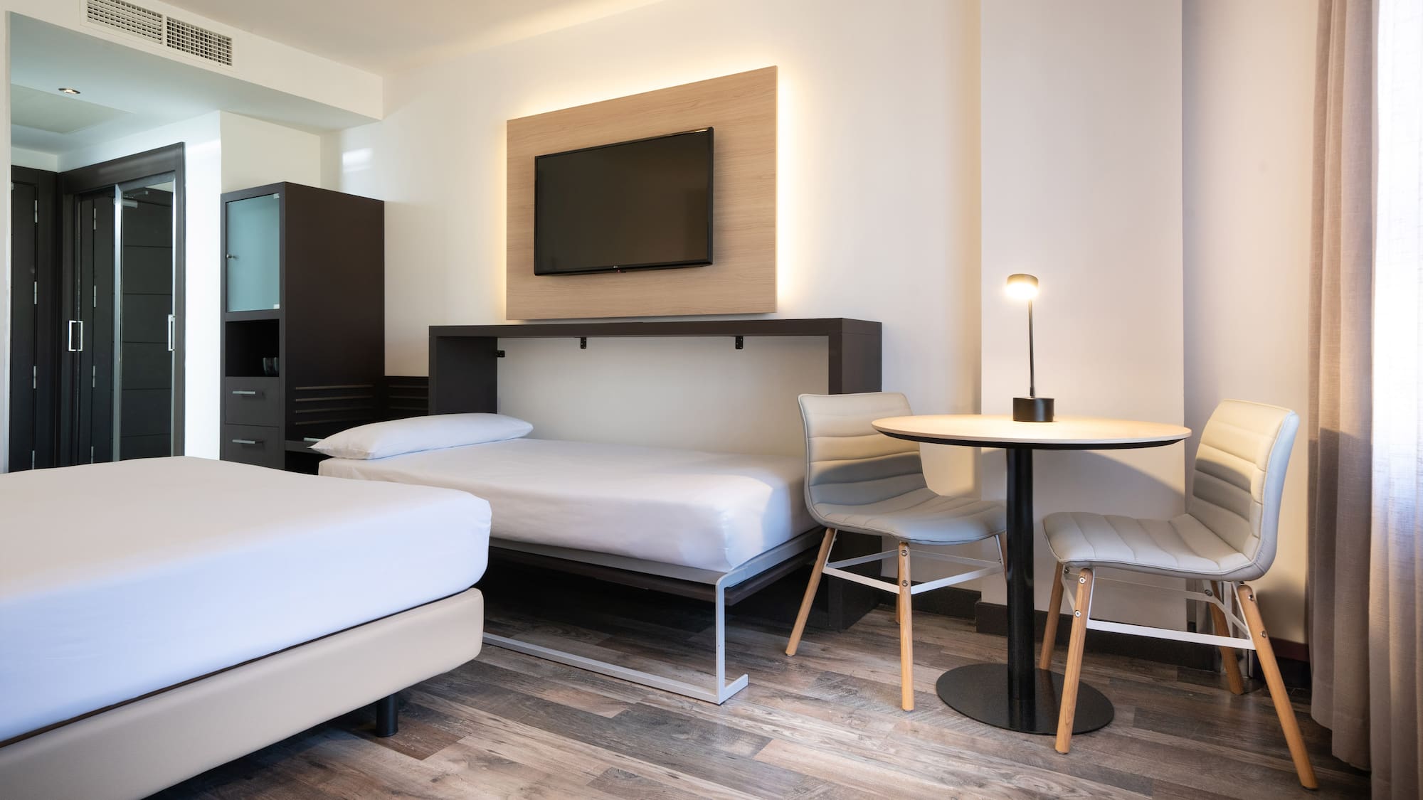 a room with a tv and a table