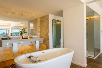 a bathroom with a tub and sink
