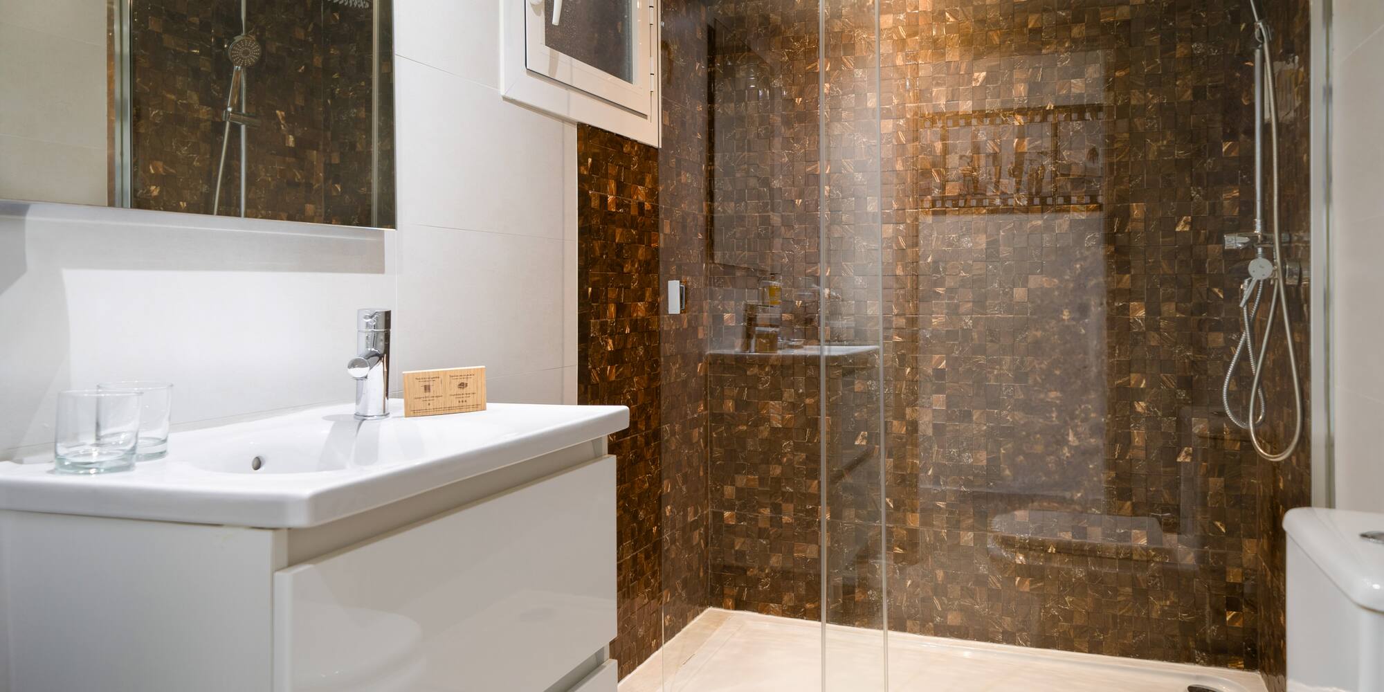 a bathroom with a shower and sink