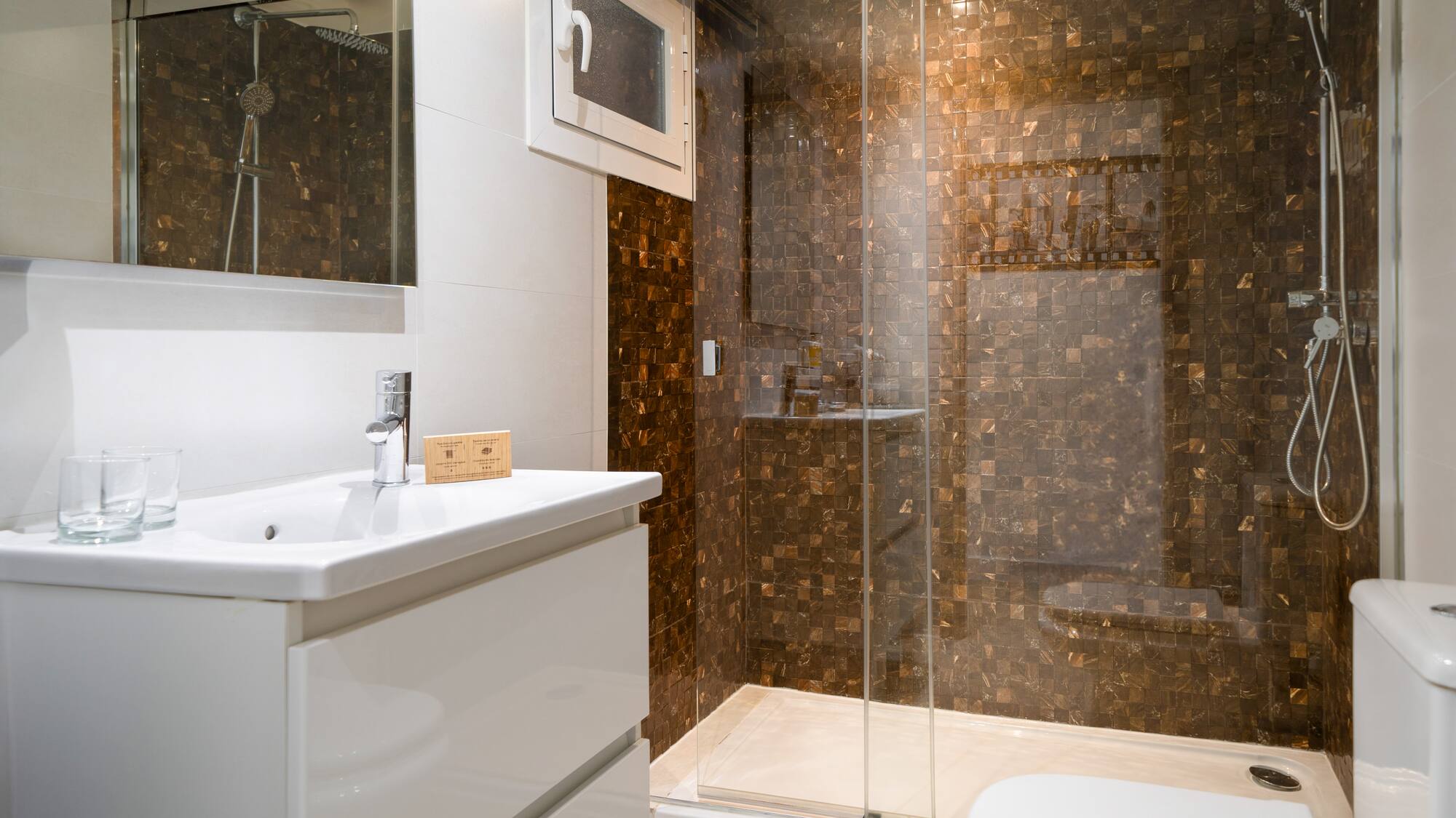 a bathroom with a shower and sink