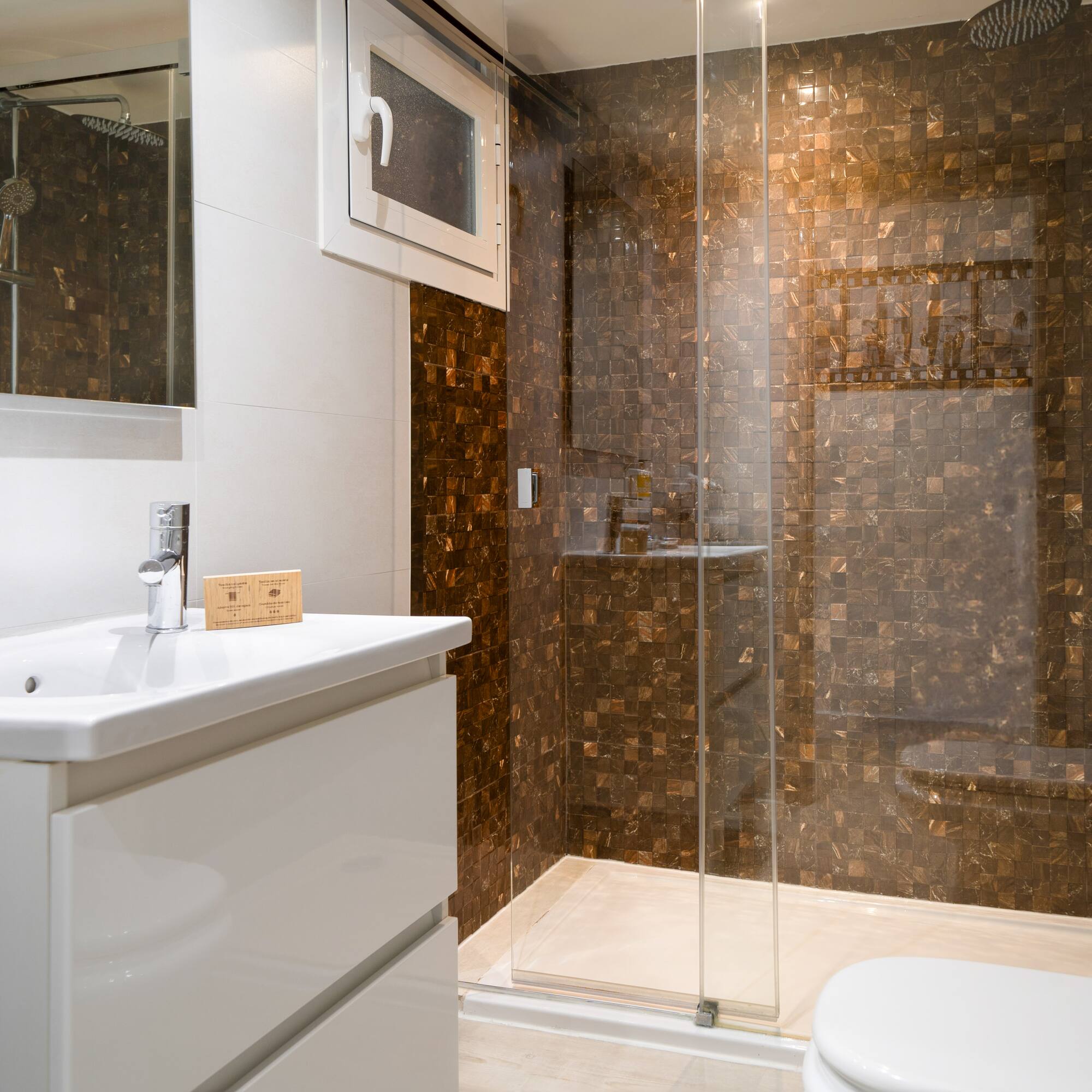 a bathroom with a shower and sink