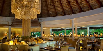 a restaurant with tables and chairs