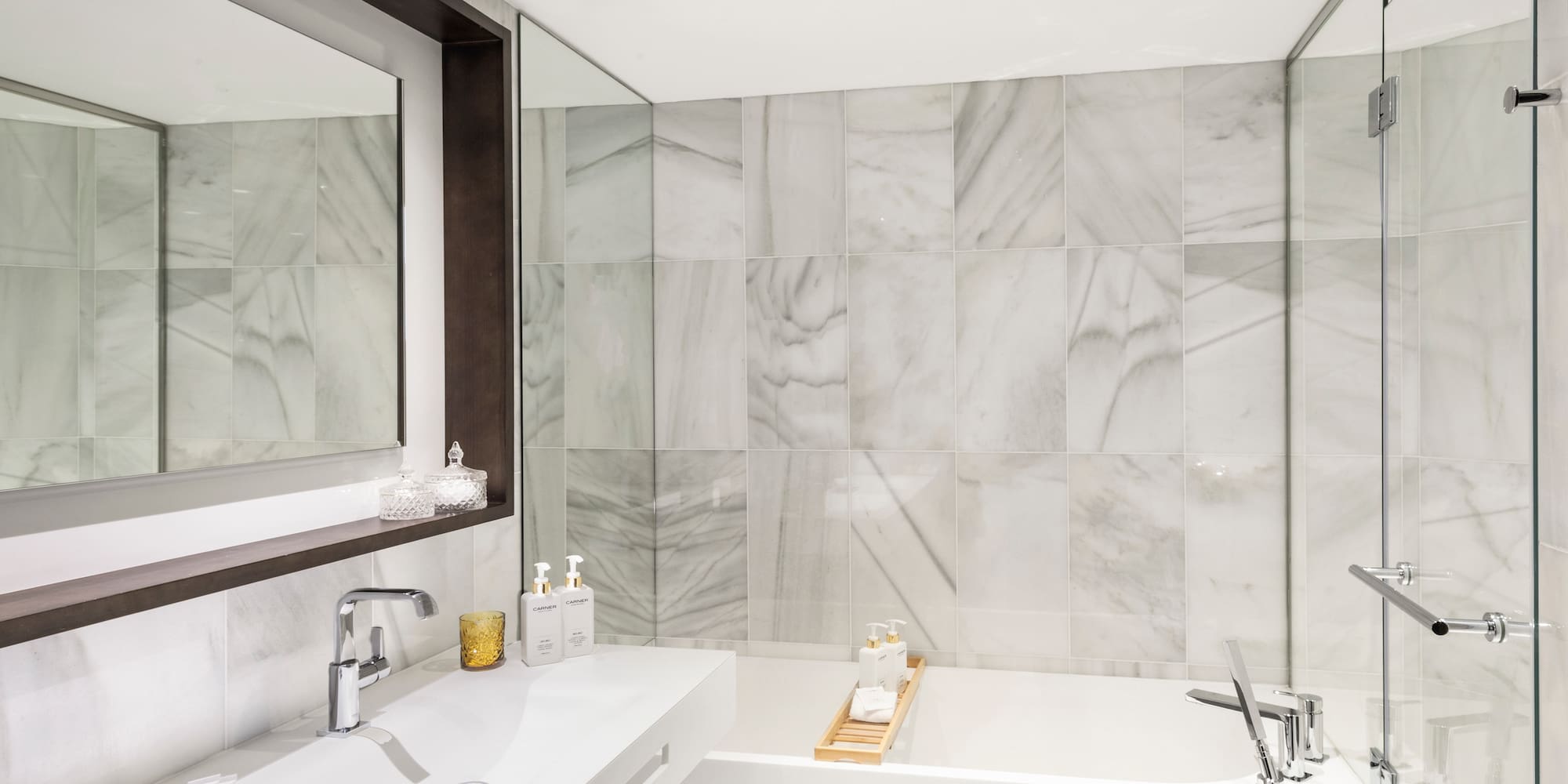 a bathroom with a bathtub and sink