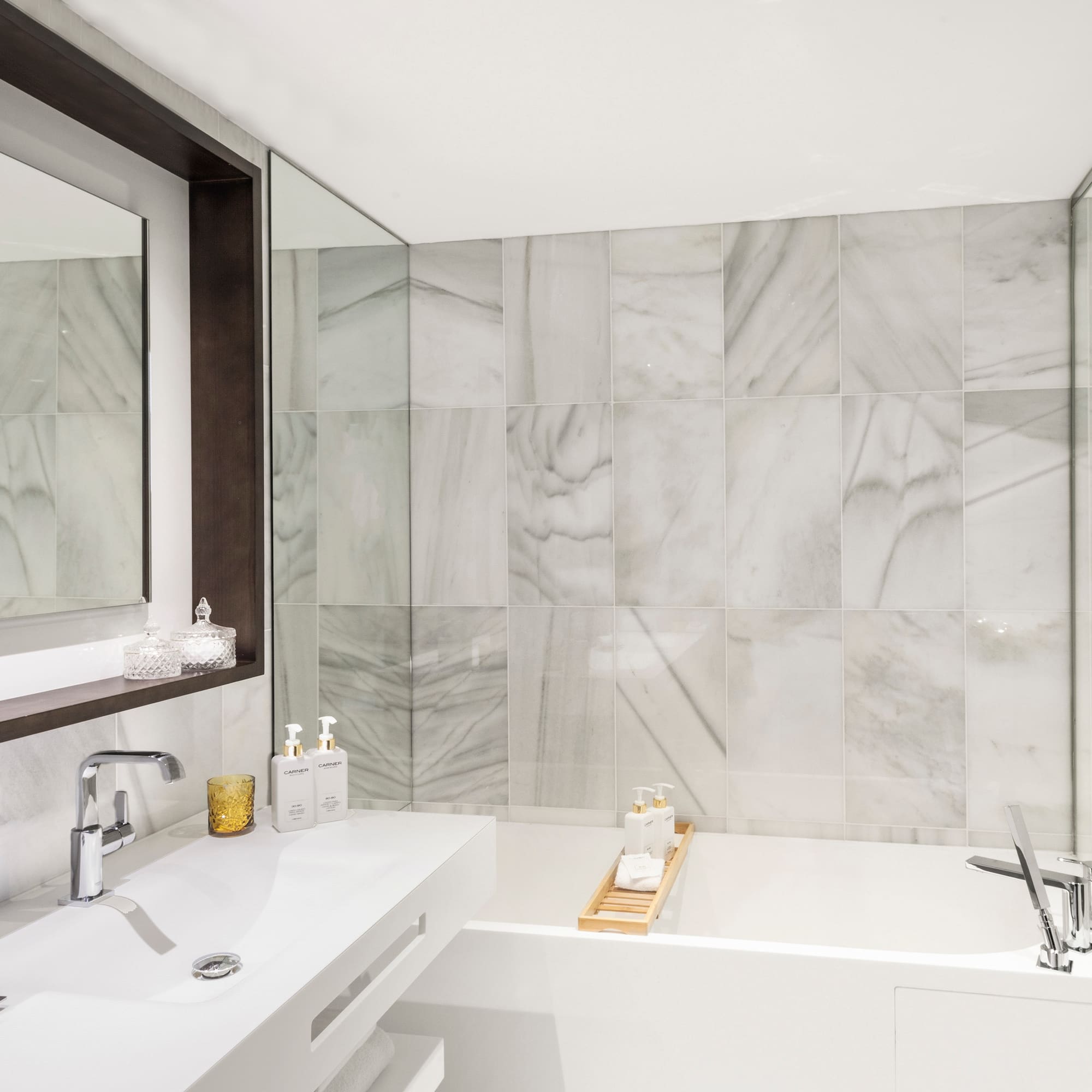 a bathroom with a bathtub and sink