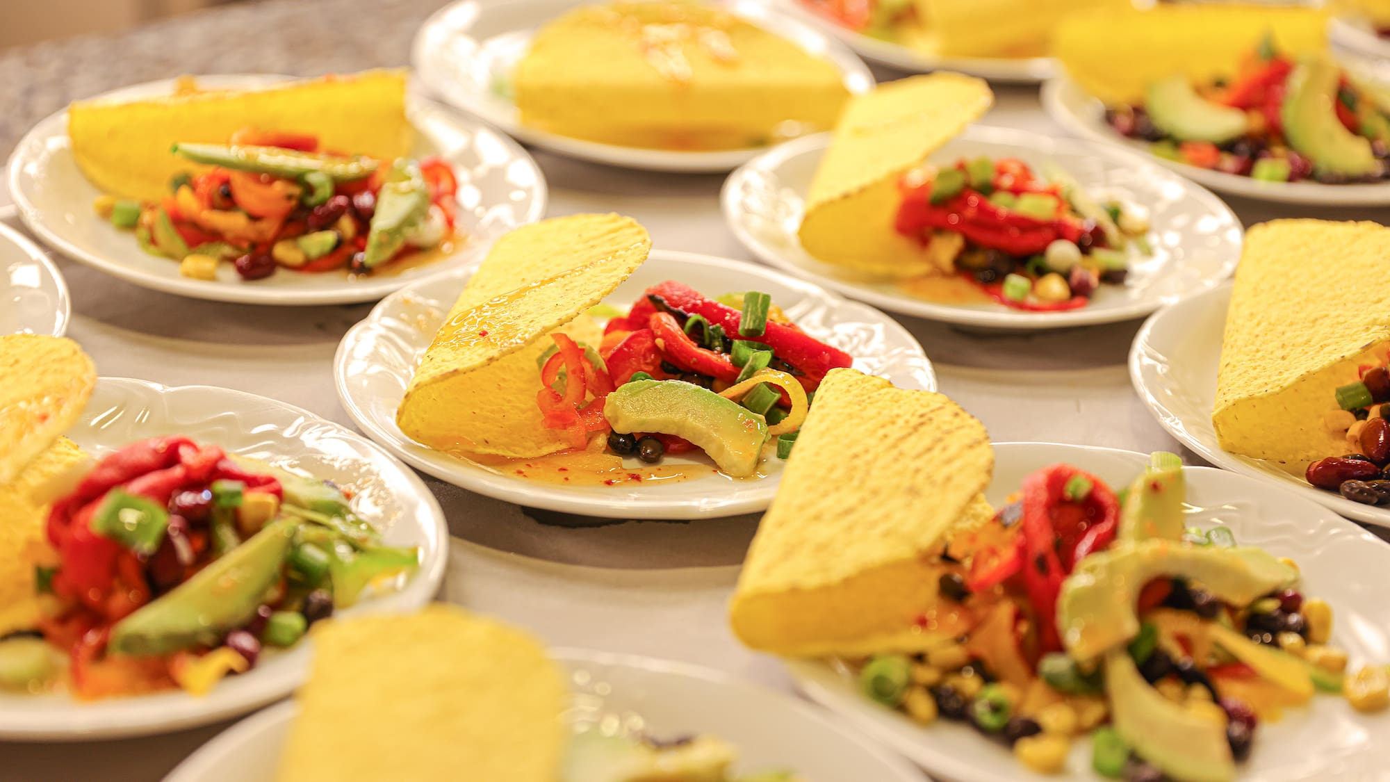 a group of plates of tacos