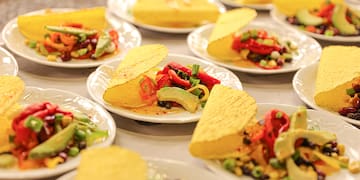 a group of plates of tacos