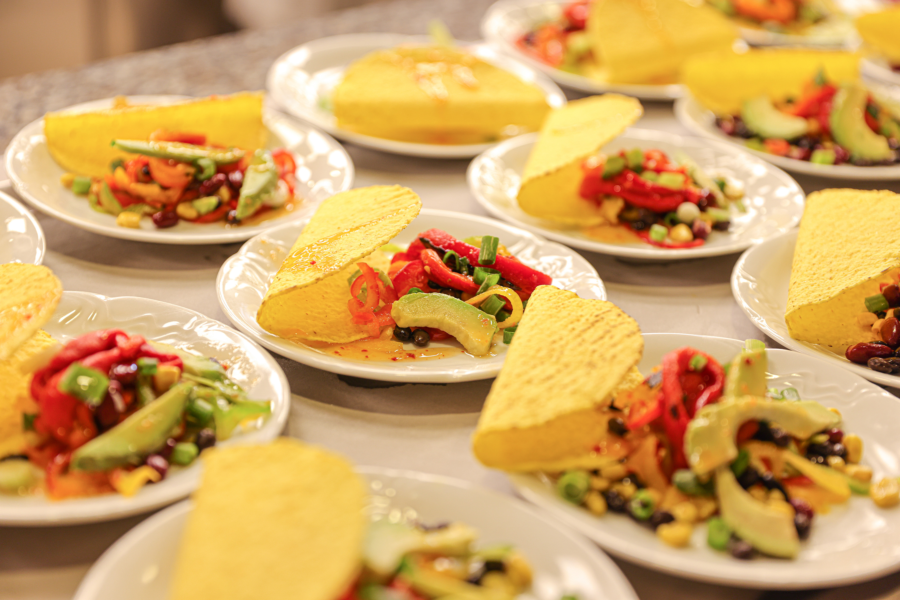 a group of plates of tacos