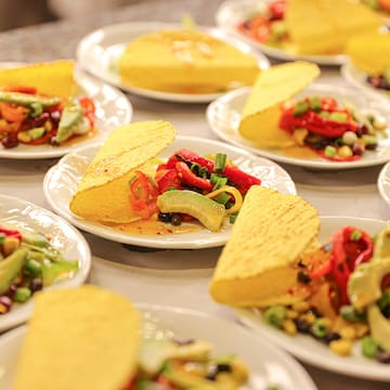 a group of plates of tacos
