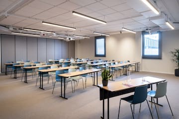 a room with tables and chairs