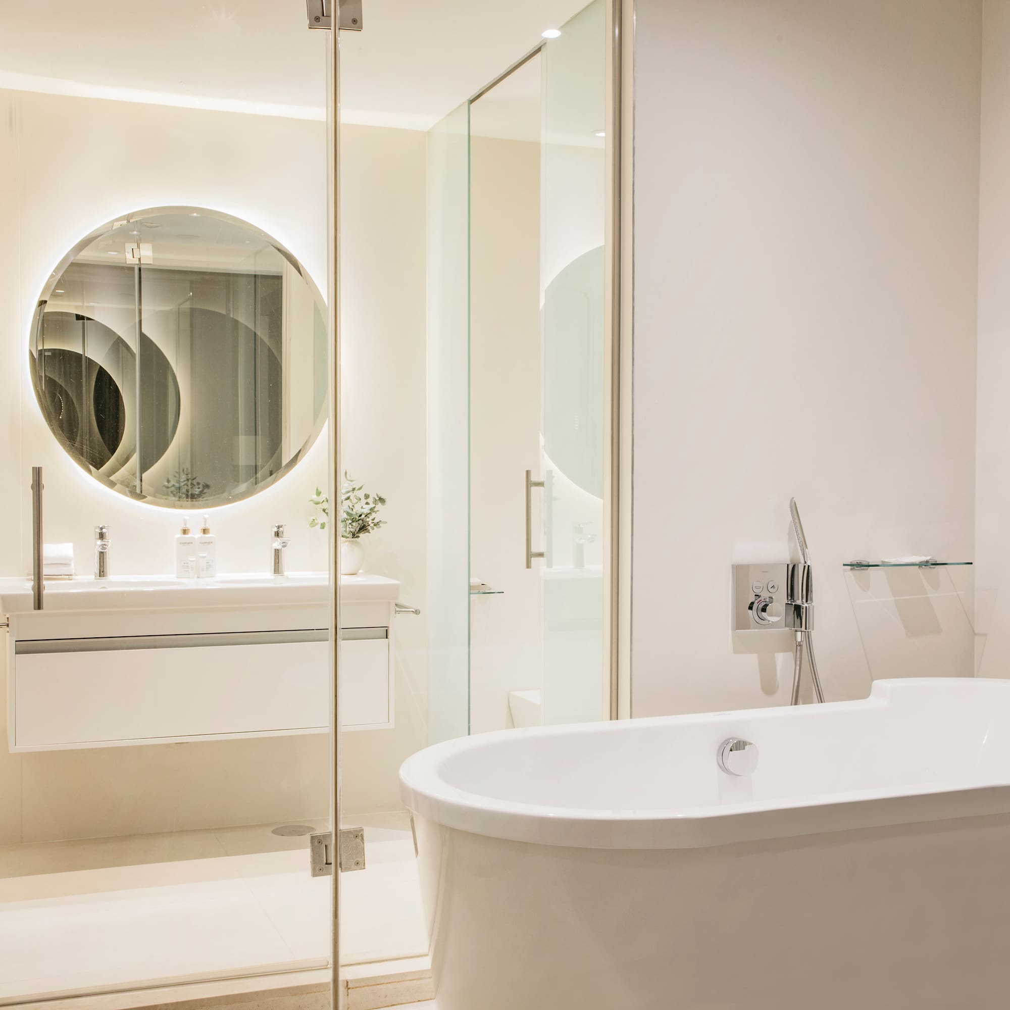 a bathroom with a tub and a mirror