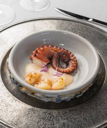 a plate of food on a silver plate