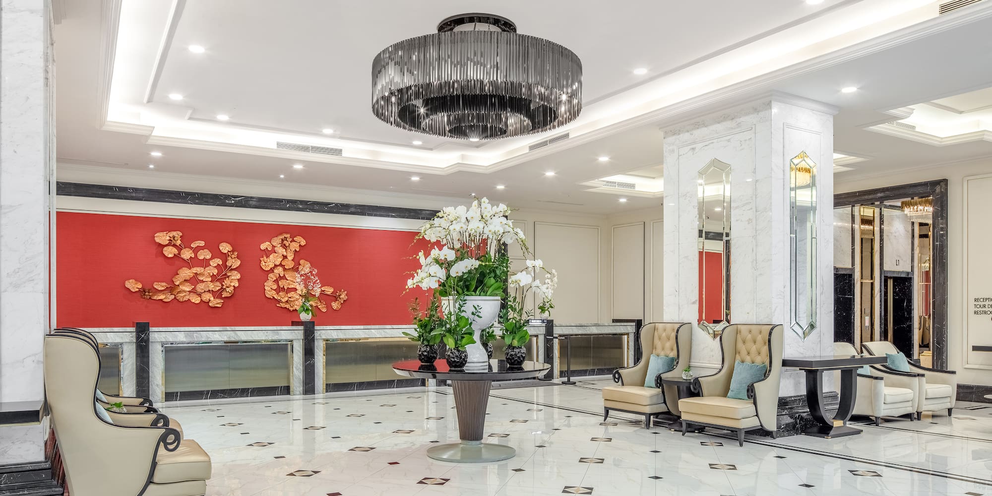 a room with a chandelier and chairs