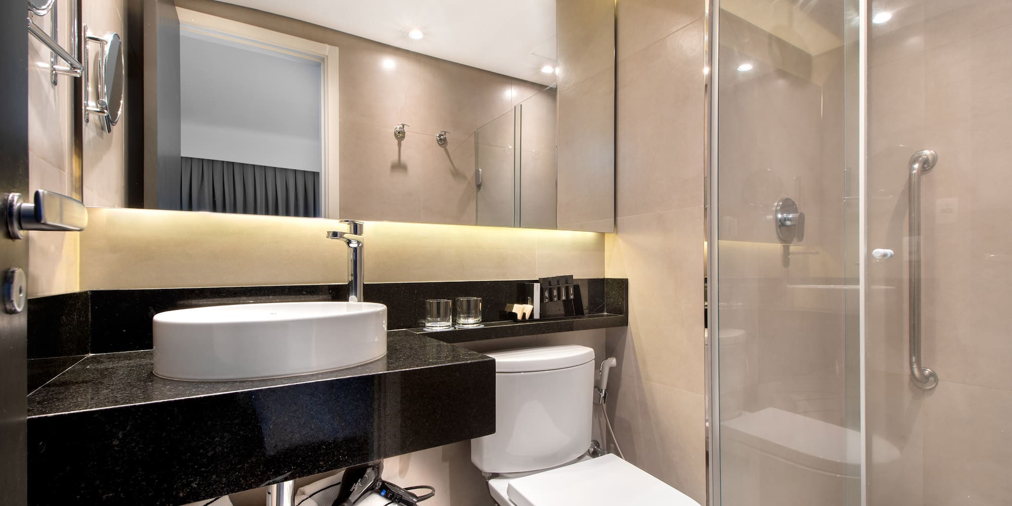 a bathroom with a sink and shower