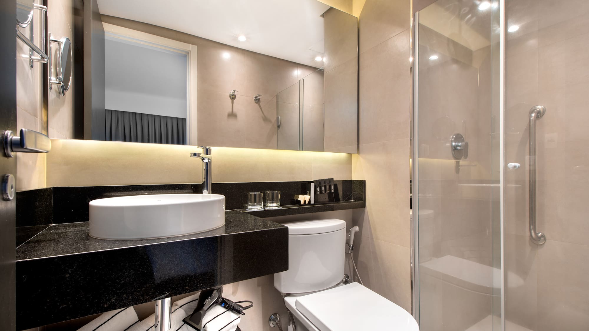 a bathroom with a sink and shower