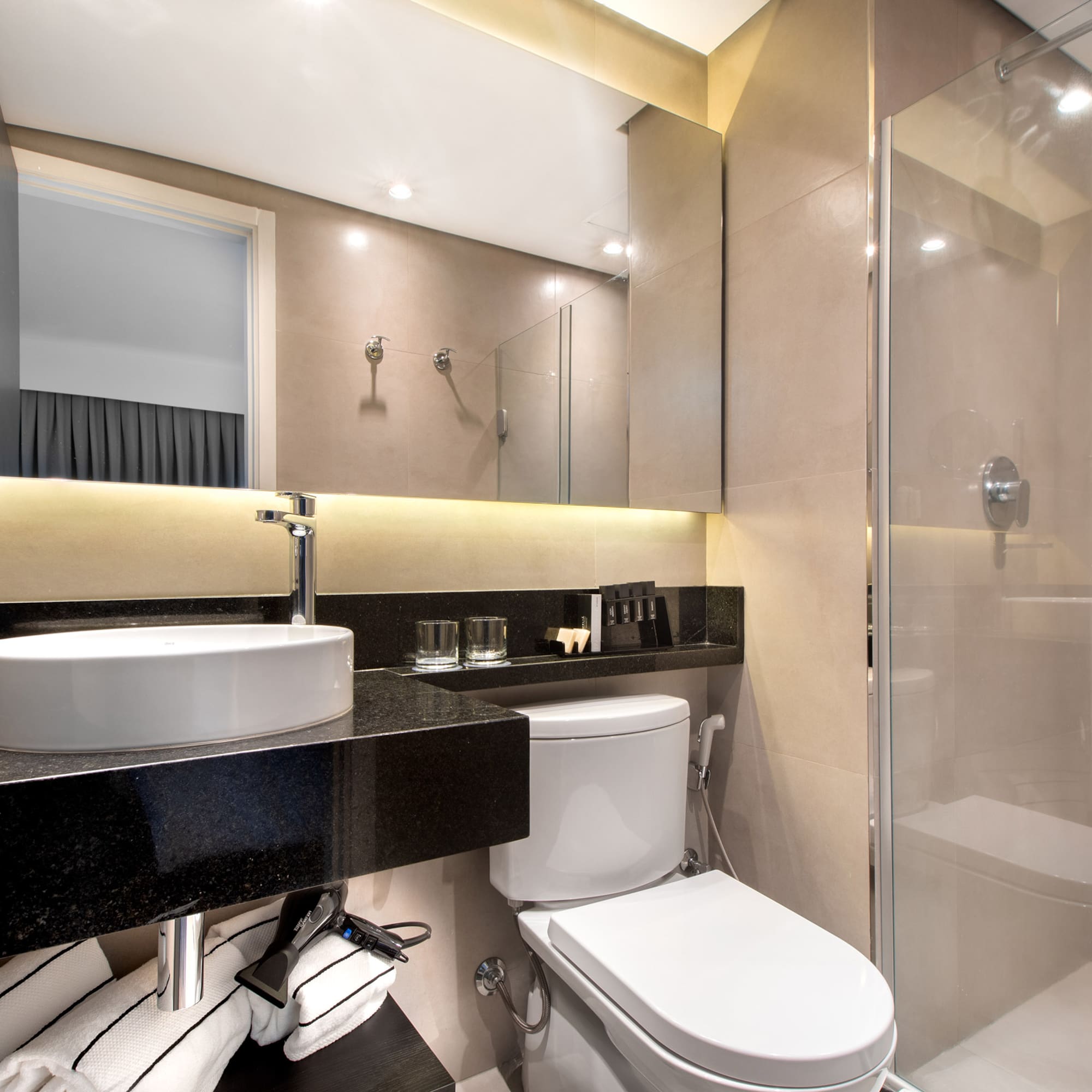 a bathroom with a sink and shower