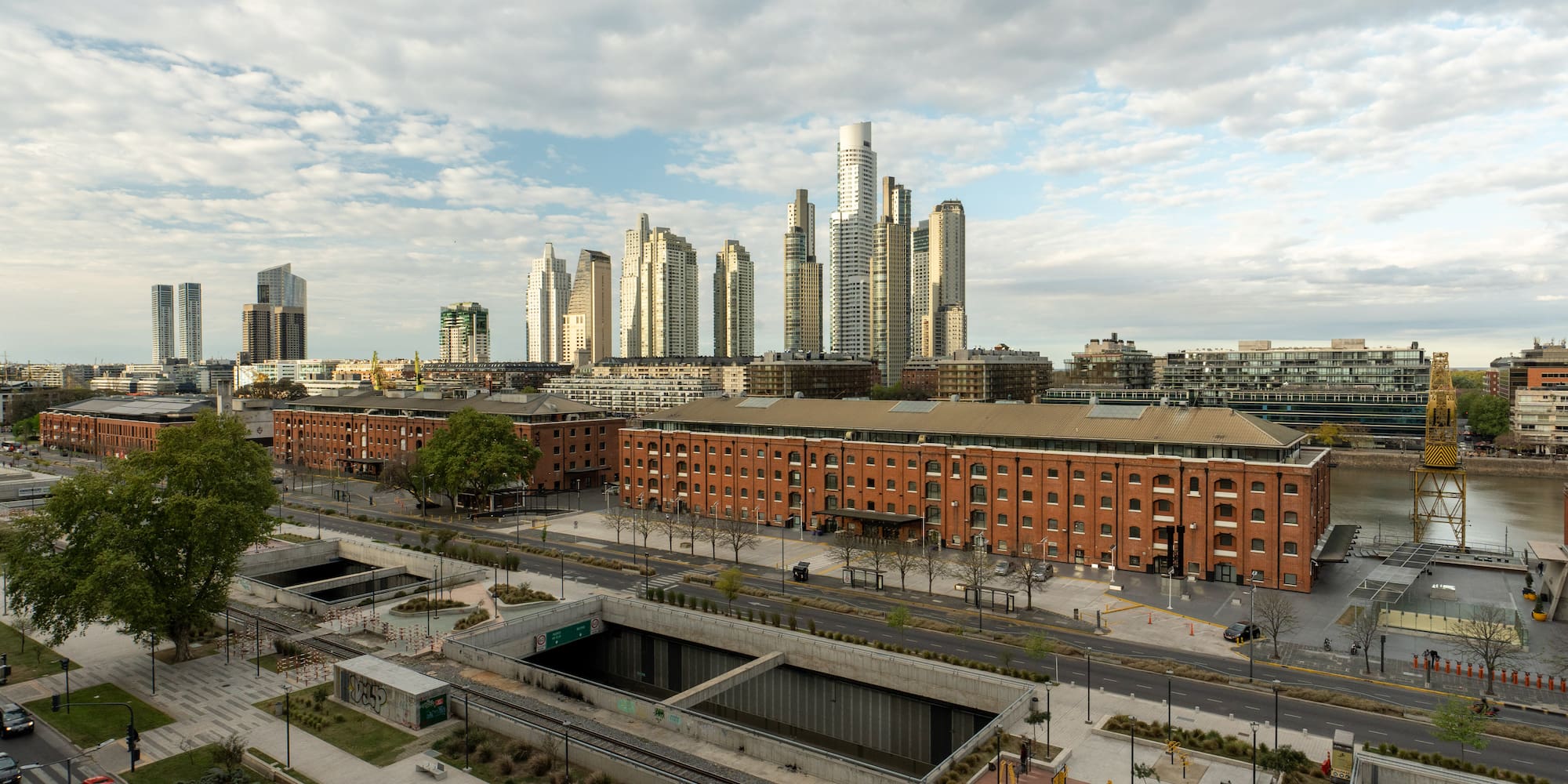 a city with a large building in the background