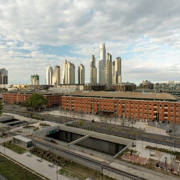 a city with a large building in the background