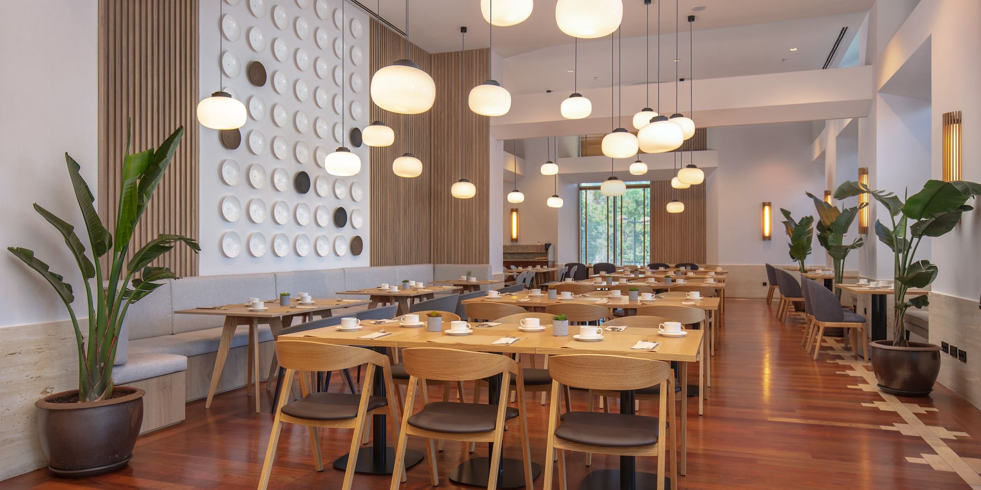 a room with tables and chairs and lamps