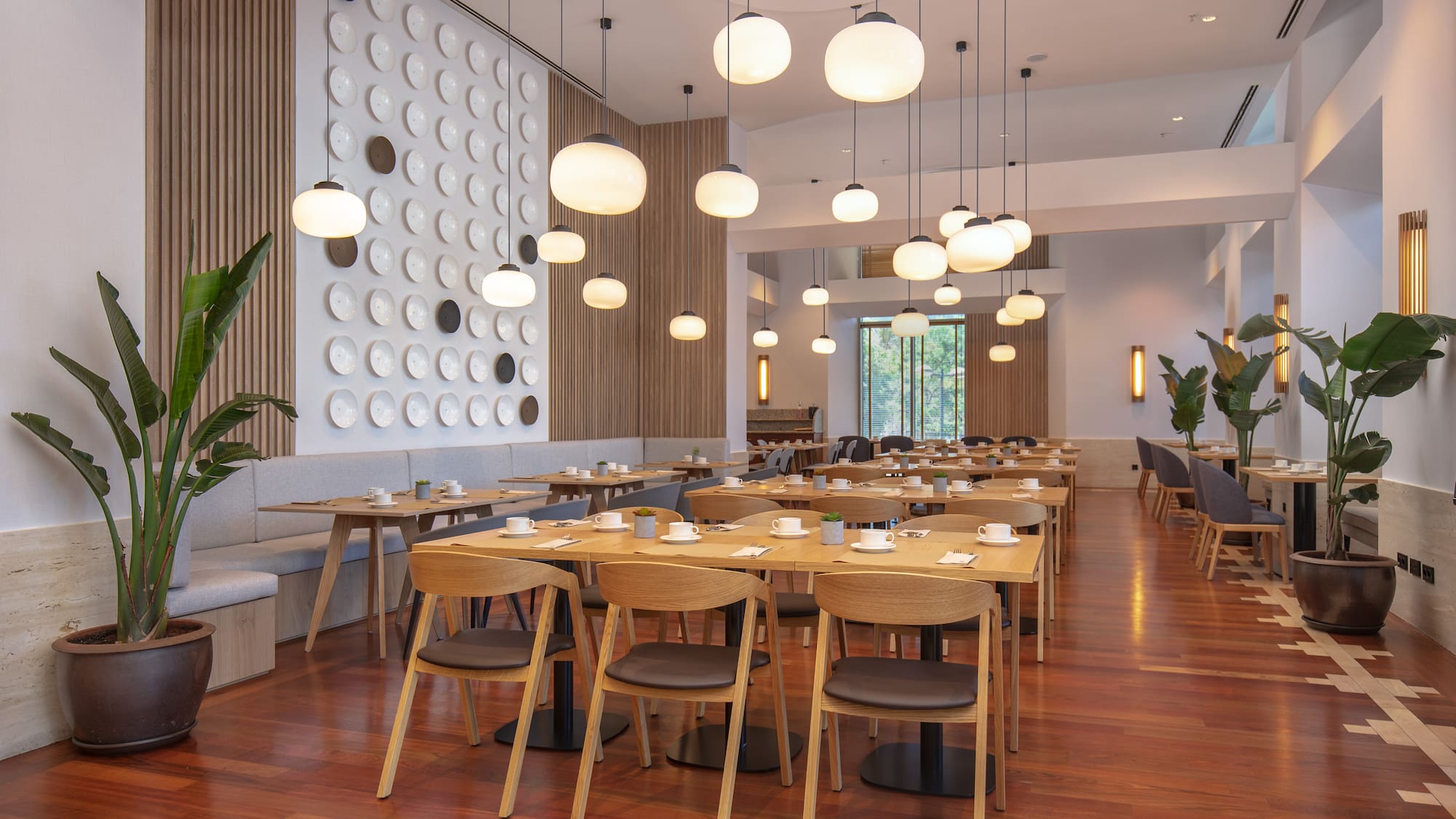 a room with tables and chairs and lamps