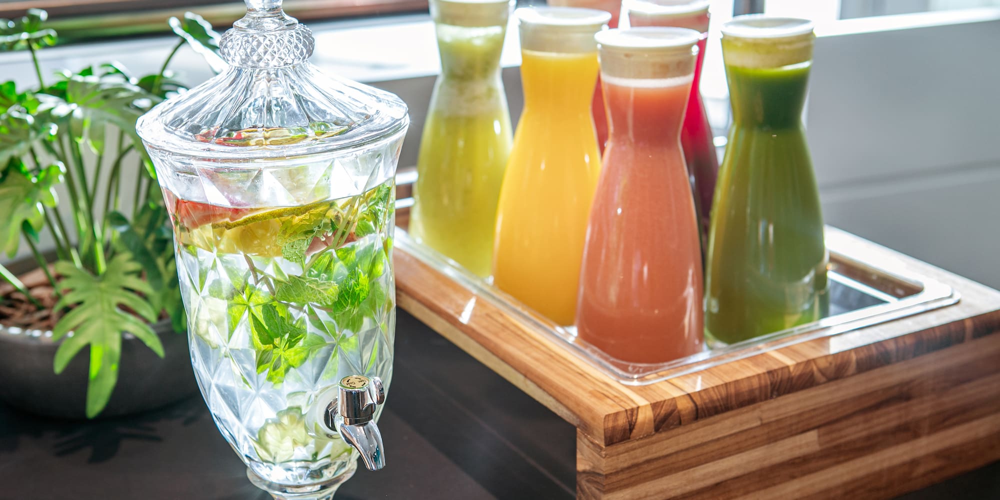 a group of drinks in a glass container