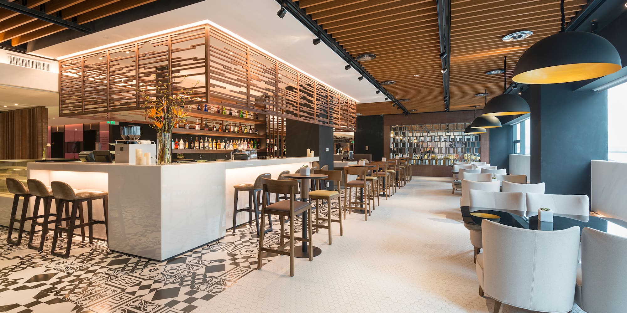 a room with a bar and chairs