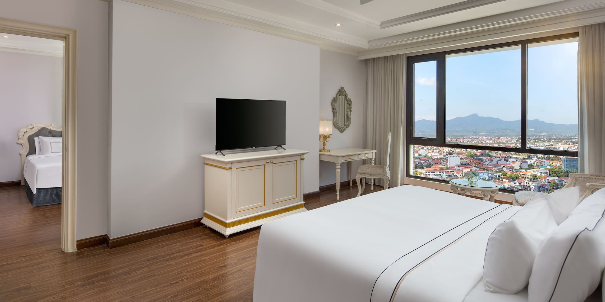 a room with a large window and a bed