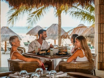 a group of people sitting at a table