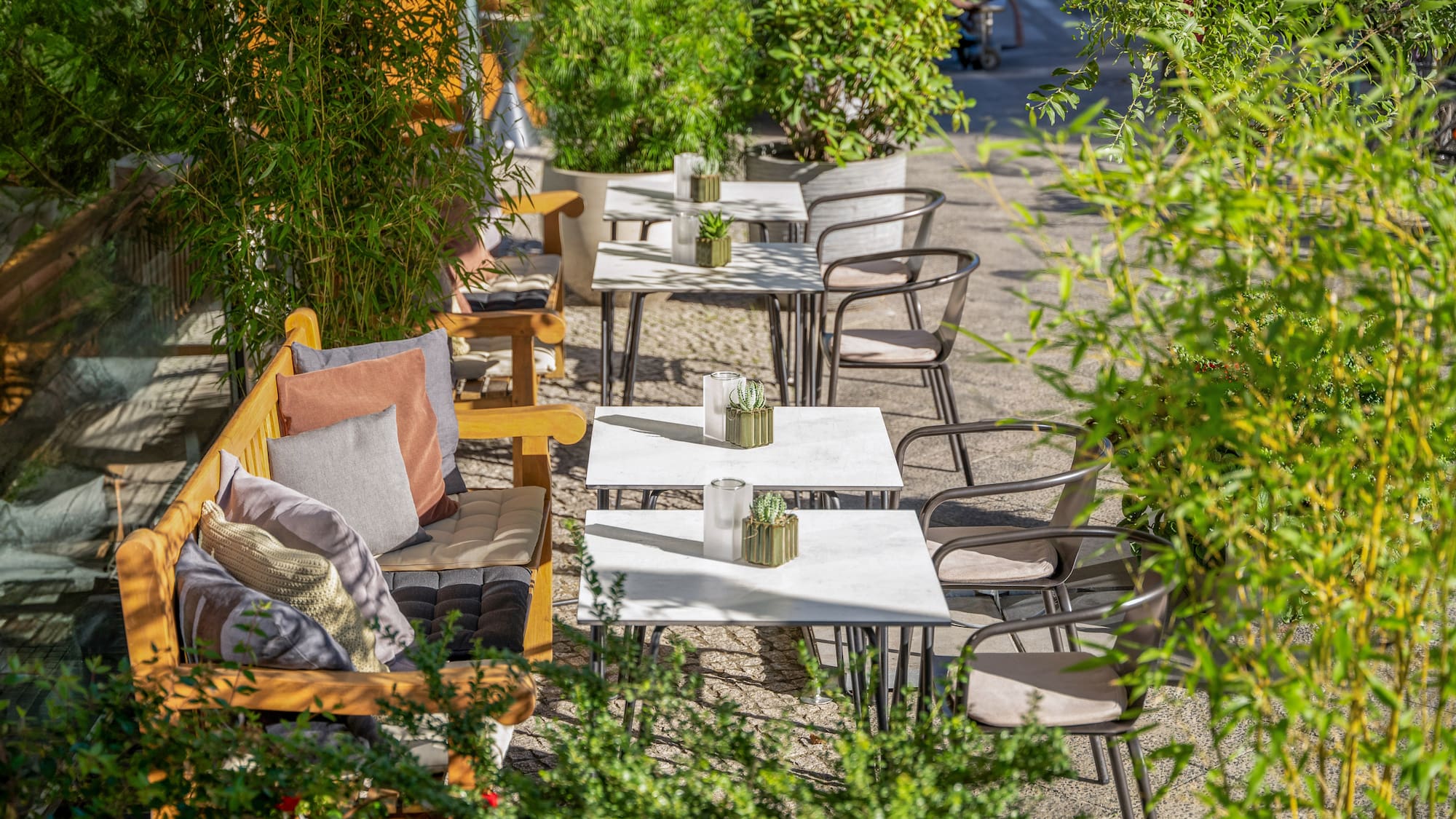 a tables and chairs outside on a sidewalk