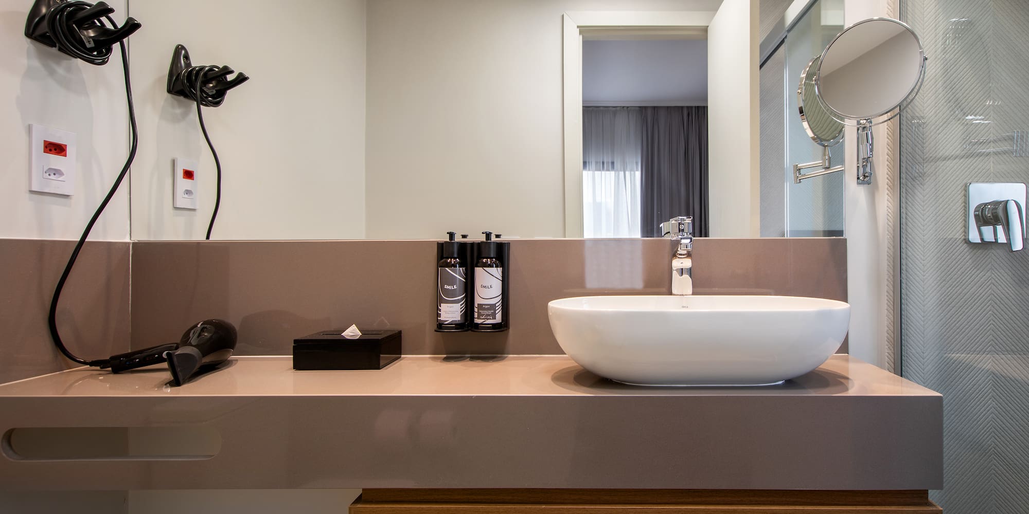 a bathroom with a sink and mirror