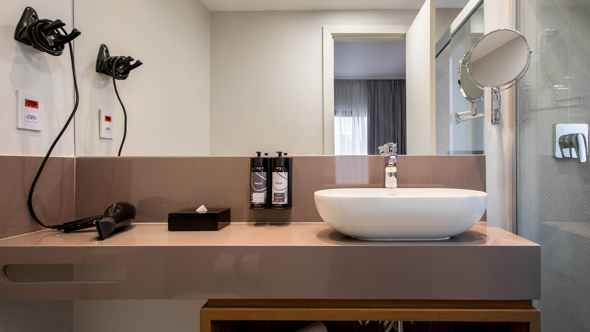 a bathroom with a sink and mirror