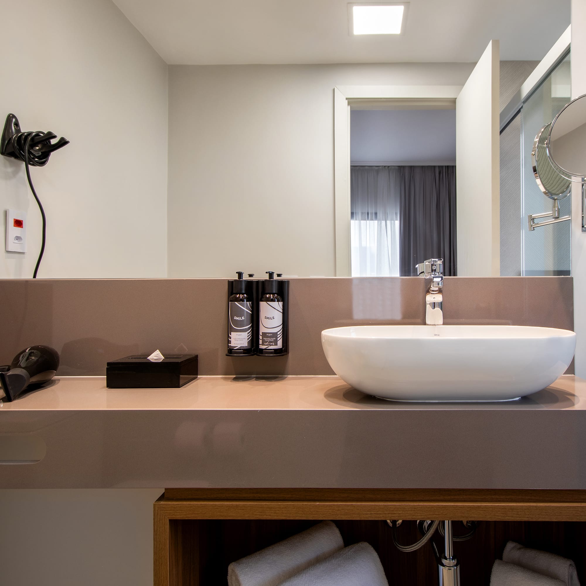 a bathroom with a sink and mirror