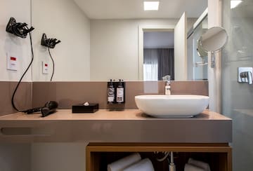 a bathroom with a sink and mirror