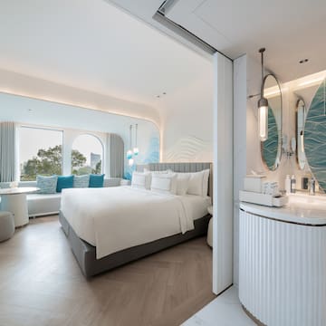 a room with a bed and a sink
